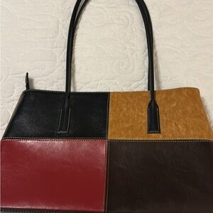 New without tags red black brown color block purse.  Perfect condition.